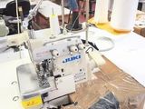 a sewing machine that is sitting on a table in a room