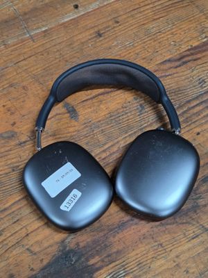 an image of a pair of headphones sitting on top of a wooden floor