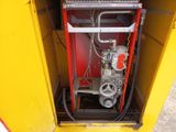 a fire hydrant that is inside of a yellow box