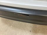 a close up of a car ' s bumper with a sticker on it