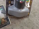 a box with a green light on it next to a box with a white light on it