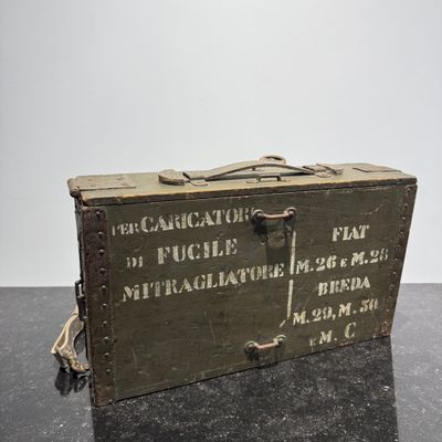 an old wooden box sitting on top of a black table