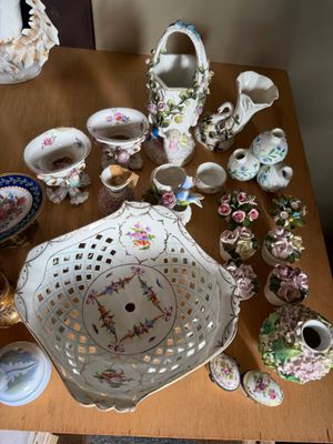 a table with a lot of vases and other items on it