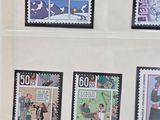 six different stamps on the wall of a building