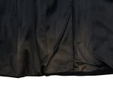 the skirt is black and has a zipper at the waist