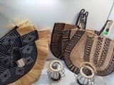 three baskets are sitting on a table with a pair of scissors
