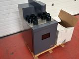a stove that is on a pallet in front of a garage door
