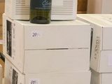 boxes of wine are stacked on top of each other on the floor