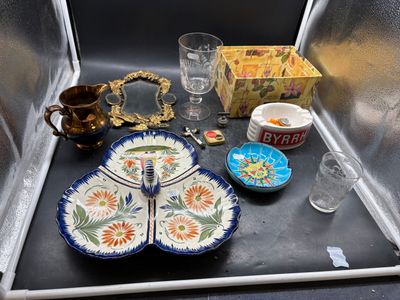 a tray with plates, cups, and a glass on it