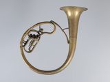 a brass instrument that is hanging from the ceiling