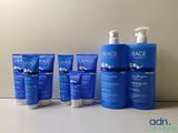 a group of three bottles of hydra hydrating lotion sitting on a table