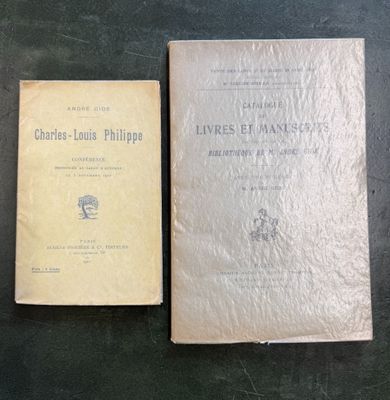 two books sitting on top of a table next to each other