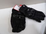 pair of black motorcycle gloves on a white counter top