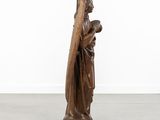an image of a statue of a woman holding a cross