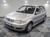 a silver car that is parked on a checkered floor
