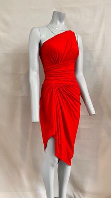 the mannequin is wearing a red dress and a necklace