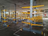 a large warehouse with a lot of shelves in the middle of it