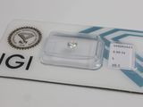 a close up of a diamond on a card on a table