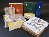several different types of stamps, books, and folders sitting on a table