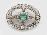 an antique emerald and diamond broochle