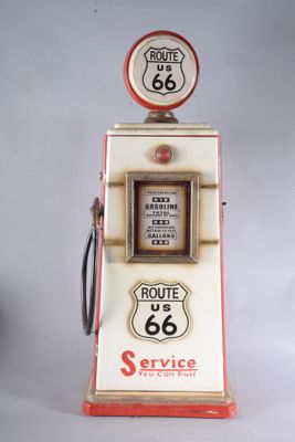 an old gas pump with a route 66 sign on top