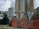 two silos that are sitting on the side of a building
