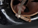 a close up of an old motorcycle with a leather seat