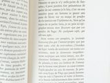 an open book with a picture of a cat on it