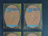 four decks of the magic the gathering deck are on display