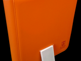 an orange binder with a white button on it