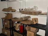 many boxes and boxes on the shelves in the room
