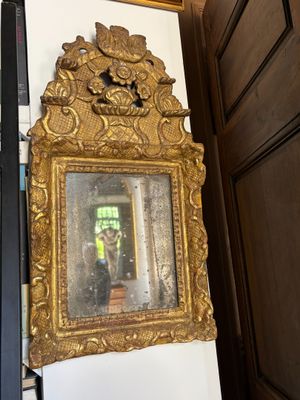 a mirror hanging on the wall next to a door
