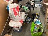 a lot of boxes and bags on the floor in a room