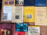 several books on a table that are sitting on top of each other
