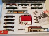 a box with a train set in it on a table