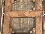 a picture of an old wooden frame with a label on it