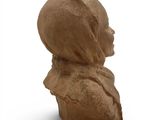 sculpture of a woman ' s head on a white background