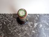 a bottle of beer sitting on top of a table