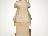 an image of a statue of a woman on a marble block