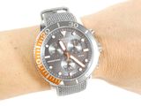 a watch on the wrist of a person on a white background