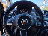 the steering wheel of a car with a steering wheel and dashboard controls