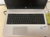 a laptop computer sitting on top of a table