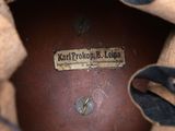a close up of a brown shoe with a label on it