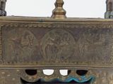 a metal box that has a painting on it