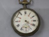 an old pocket watch with roman numerals on it