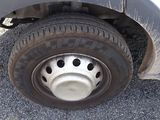 a close up view of a flat tire on a truck