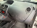 a dirty dashboard of a car with a steering wheel