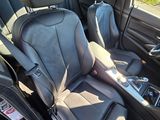 the interior of a car with two seats and a steering wheel