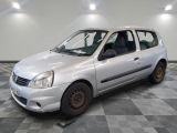a picture of a small white car parked on a checkered floor