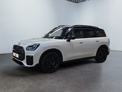 the white suv is parked in a large room